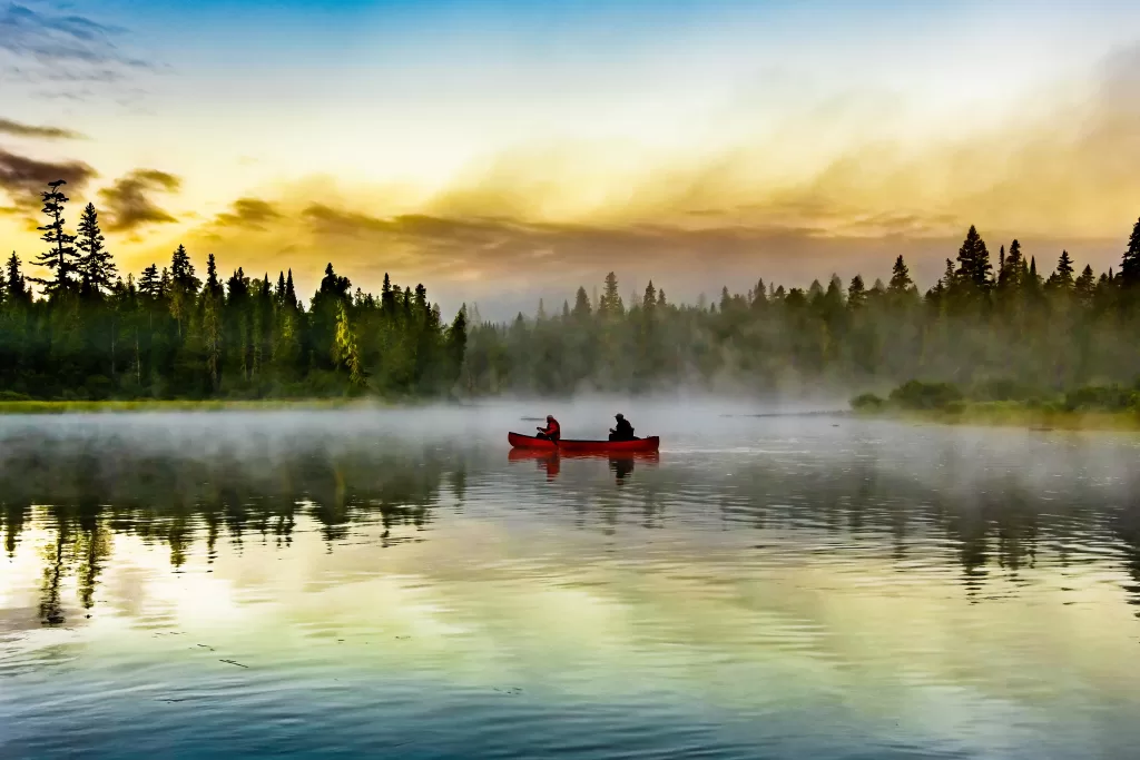 Canoe on a lake at sunrise