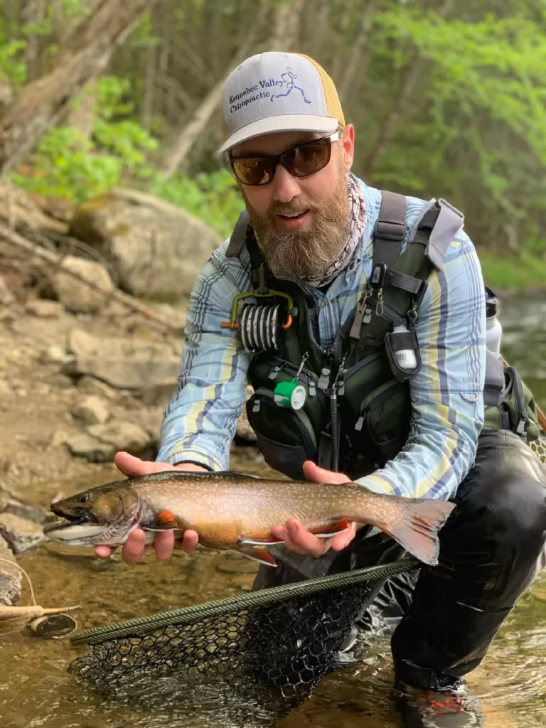 fisherman holding a fish