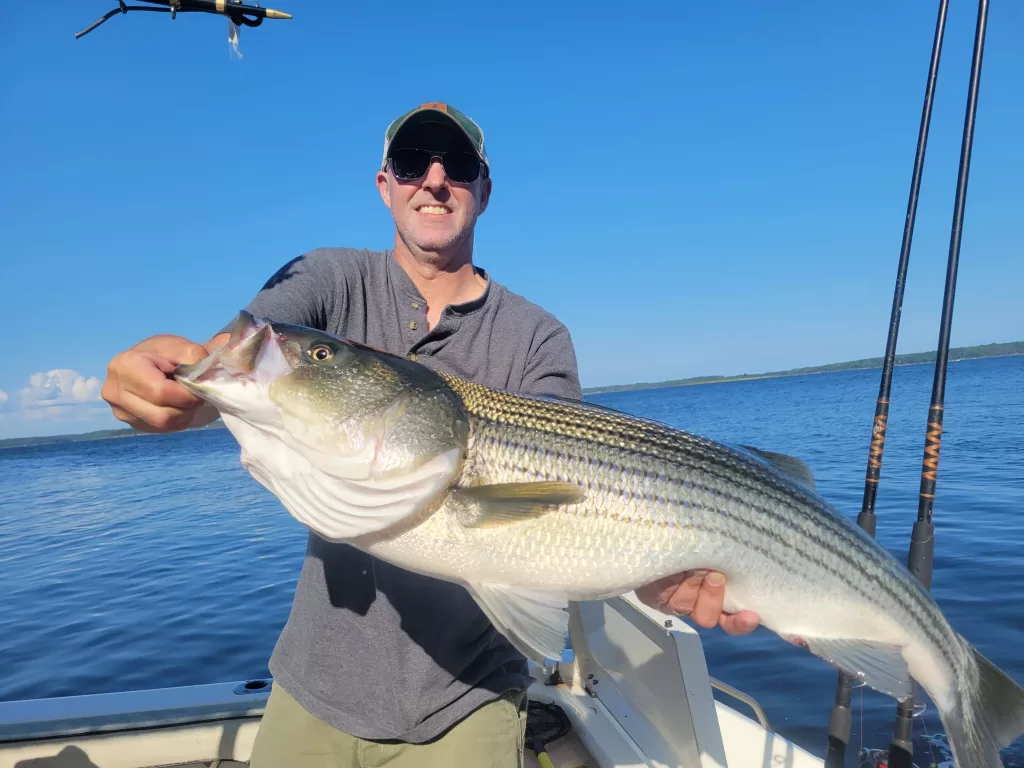 fisherman holding large fish