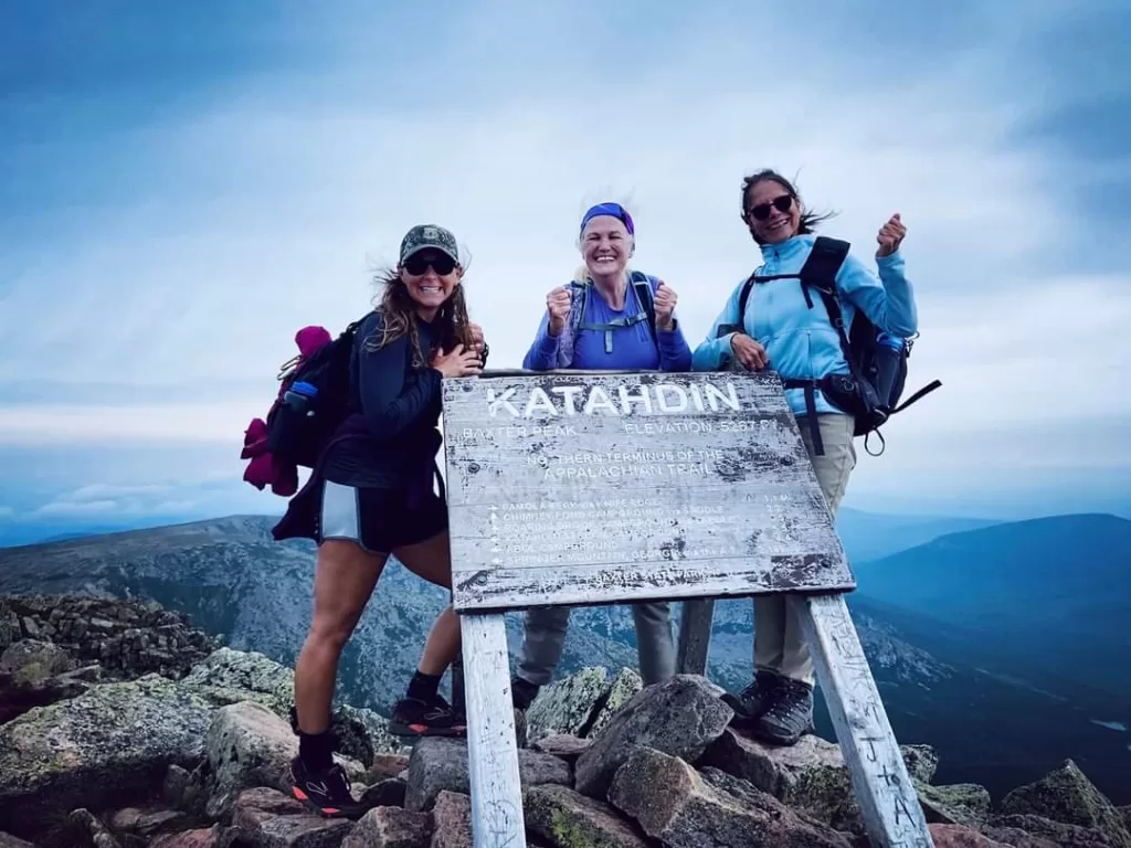 3 hikers at the top of Mount Katahdin